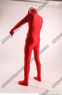 JOEL_ADAMSON CHRISTMAS VALLAIN WITH GUN AND BAG